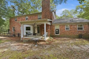 Rear exterior with covered porch and backyard at 176 Arlington Row in Castlegate, Macon GA